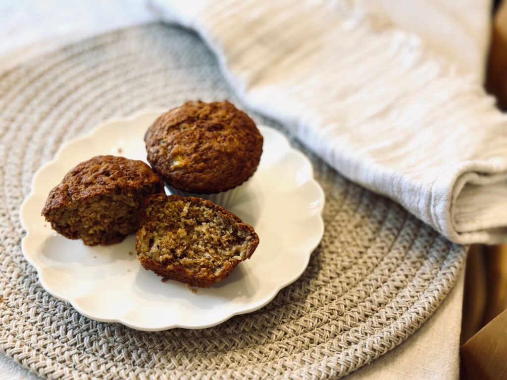 plate of sourdough Banana muffins on a round jute place mat