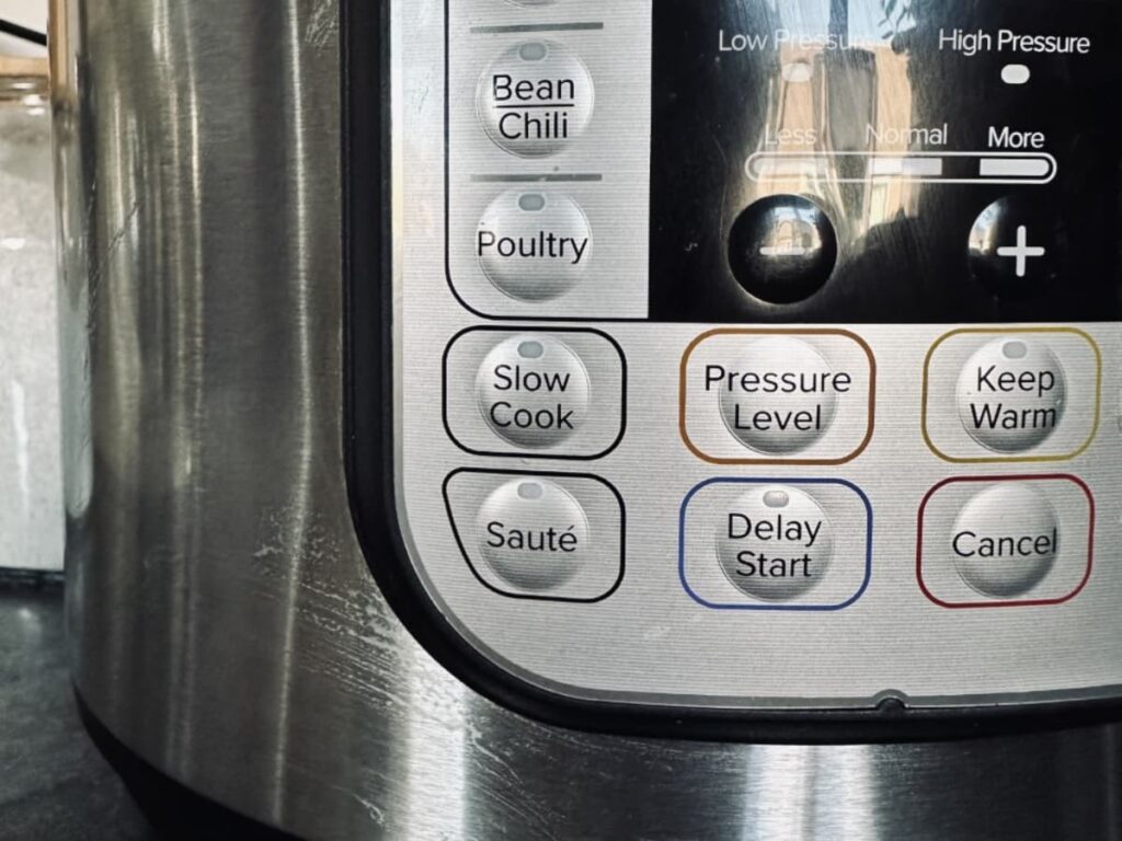 A close up of the buttons on an instant pot