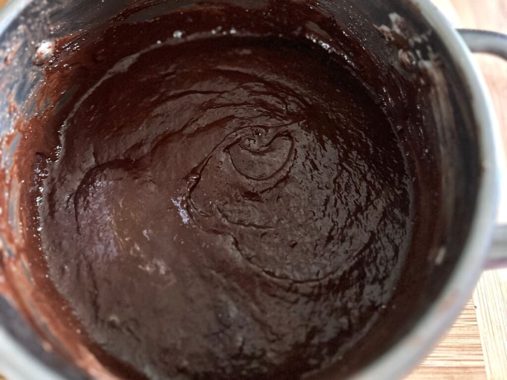 Thick Sourdough Brownie batter in a pan