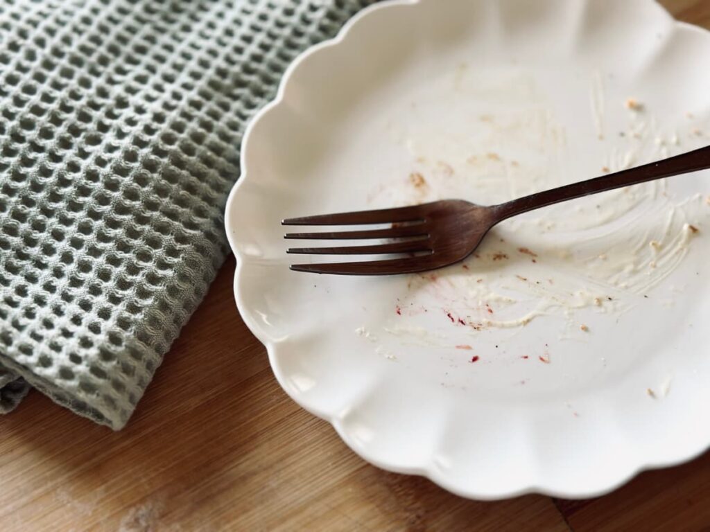 A empty plate with a fork on it