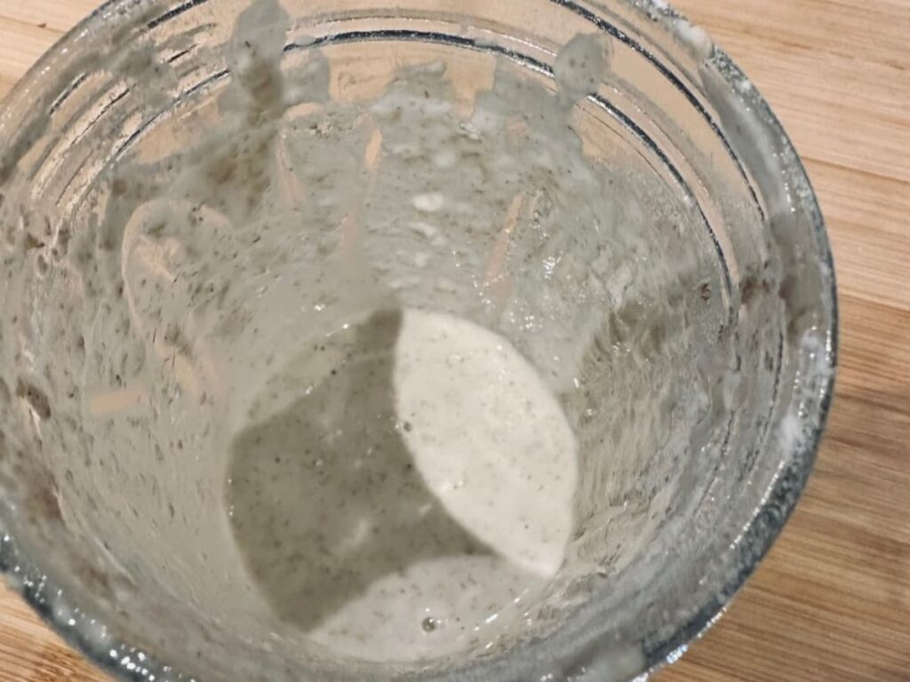 a close up of a sourdough starter on day 1