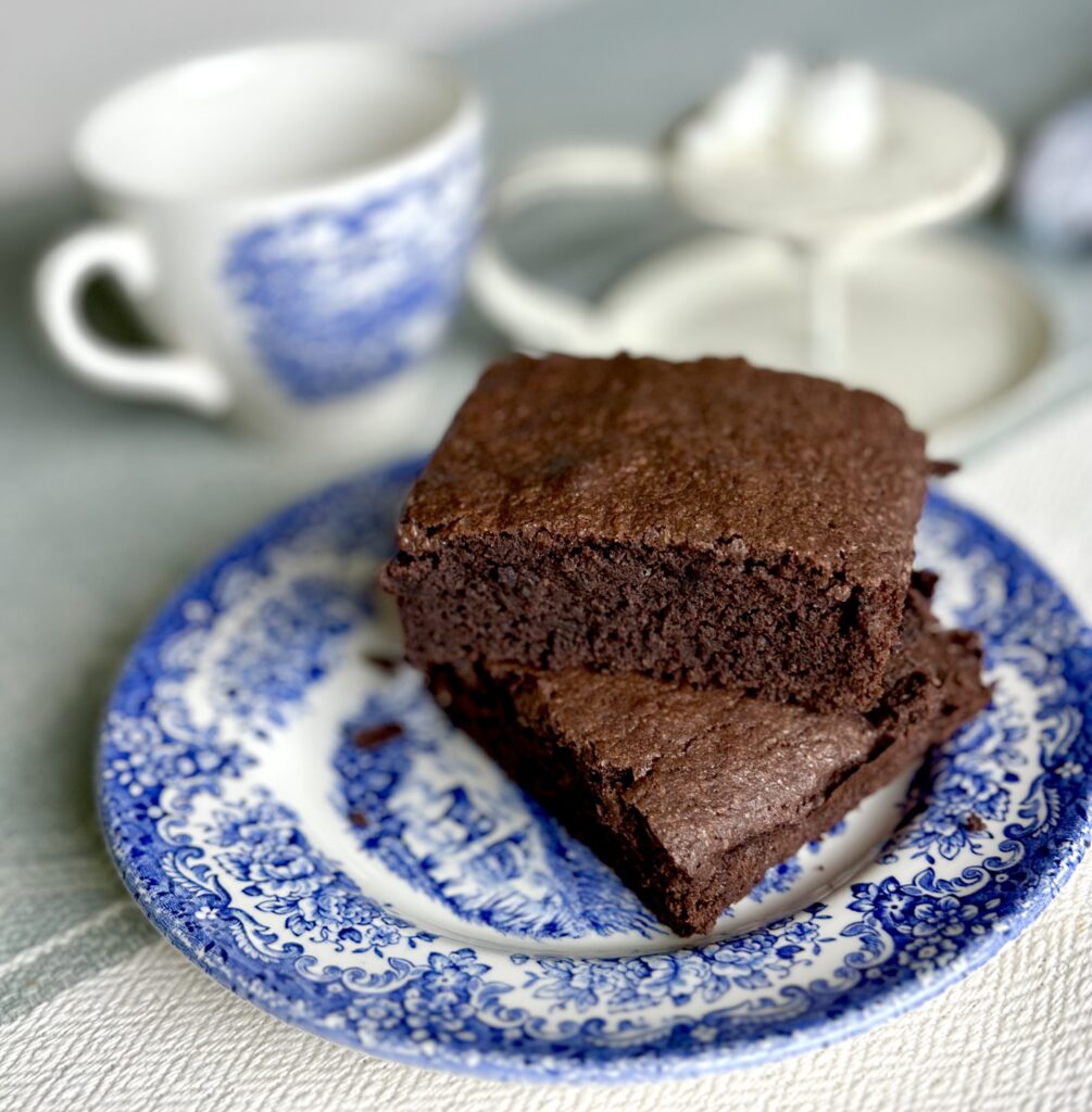 Sourdough brownies on a blue and white China plate