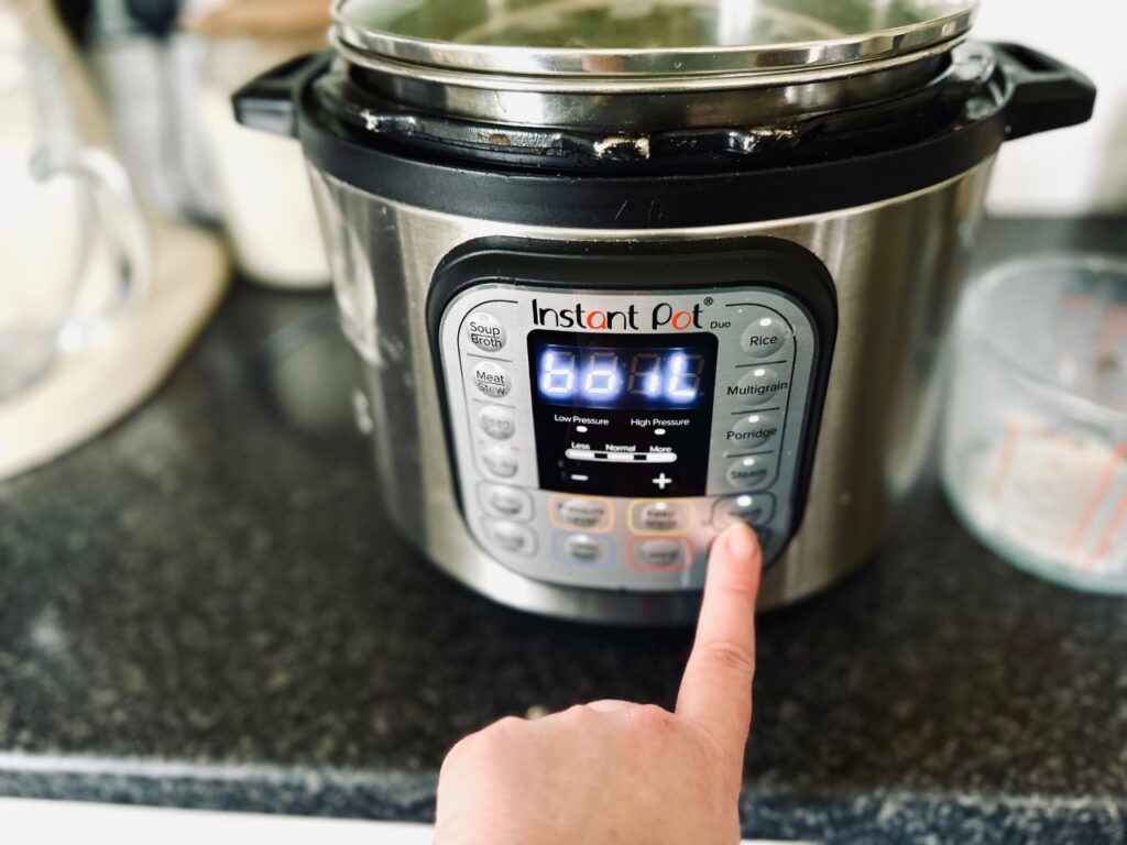 An instant pot that say boil with a finger on the yoghurt function