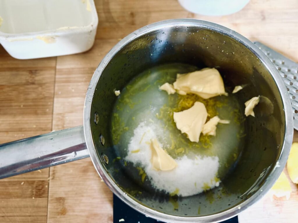 A pan of ingredients for how to make an easy lemon curd