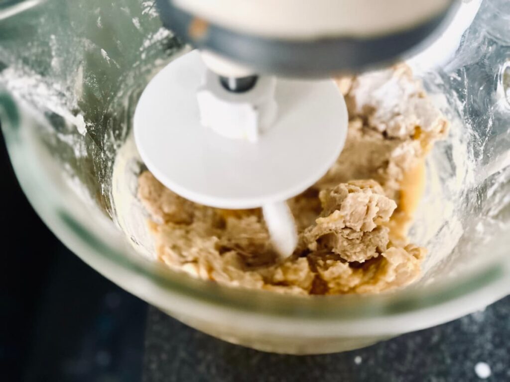 A mixer containing the rough dough of Sourdough Lemon Rolls